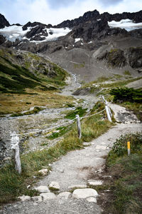 Scenic view of stream amidst mountains