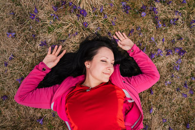 High angle view of young woman standing amidst plants