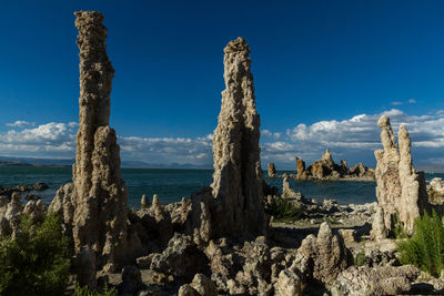Scenic view of mono lake against blue sky