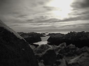 Scenic view of sea against cloudy sky