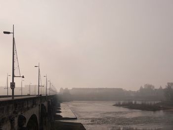 Bridge over river against sky