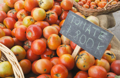 Fresh fruits in basket for sale at market stall