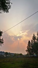 Scenic view of field against sky during sunset