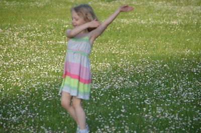 Girl playing on grass