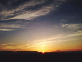 Scenic view of landscape at sunset