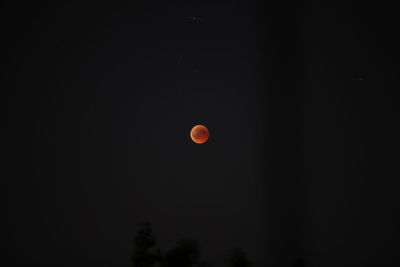 Low angle view of moon against sky at night