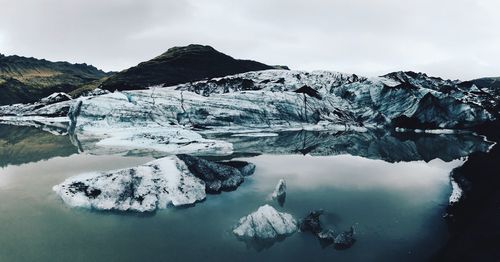 Scenic view of frozen lake against sky