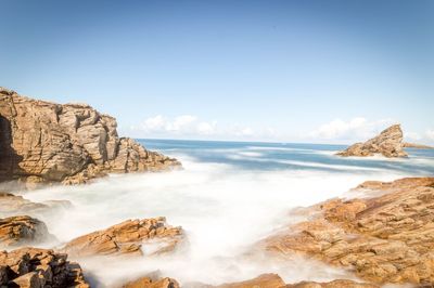 Scenic view of sea against clear blue sky