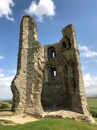 Low angle view of old ruin building against sky