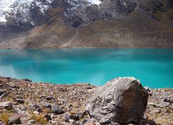 Scenic view of rocks by lake