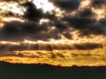 Scenic view of dramatic sky during sunset