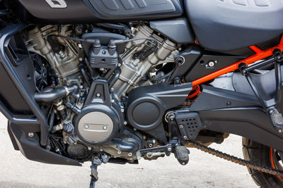 Harley-davidson pan america 1250 motorcycle on parking at spring day, close view of engine