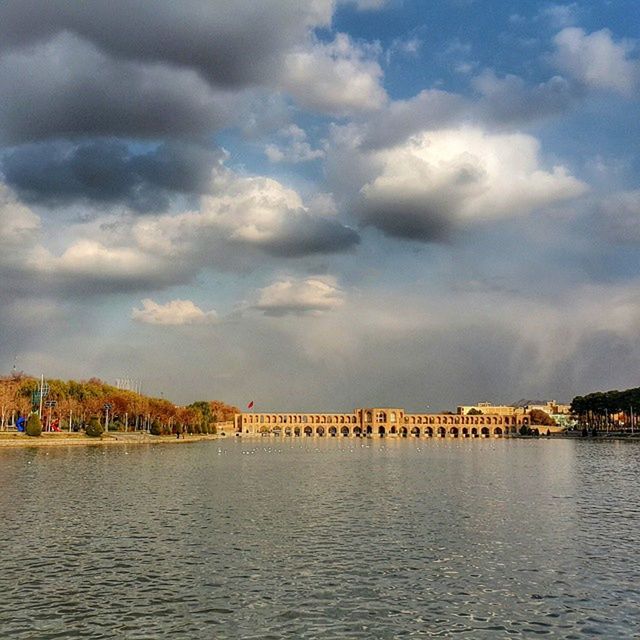 water, sky, waterfront, cloud - sky, tranquil scene, tranquility, sea, scenics, cloudy, beauty in nature, nature, cloud, tree, river, built structure, rippled, idyllic, pier, lake, architecture