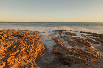 Scenic view of sea against clear sky