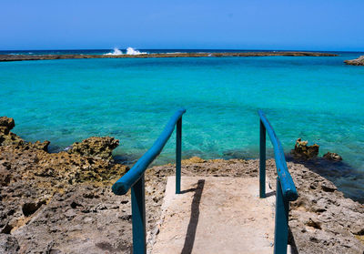 Scenic view of sea against clear blue sky