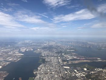 High angle view of buildings against cloudy sky