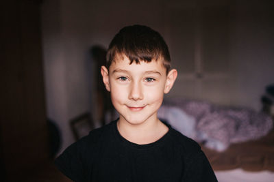 Portrait of boy smiling at home