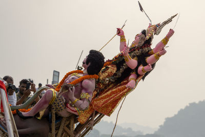 Group of people against clear sky