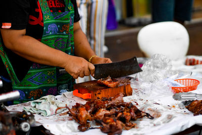 Midsection of person preparing food