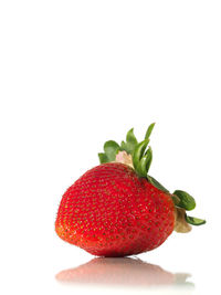 Close-up of strawberry over white background