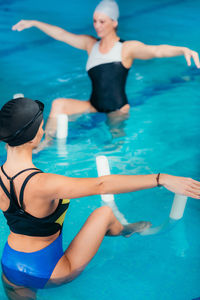 High angle view of woman swimming in pool