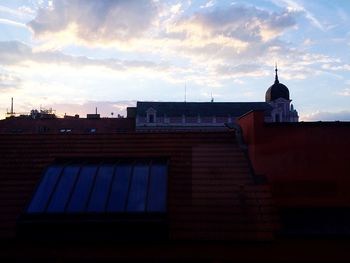 Low angle view of building against cloudy sky