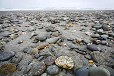 Close-up of stones on shore