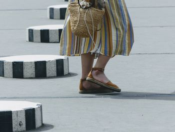 Low section of woman standing on floor