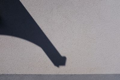 High angle view of shadow on wall