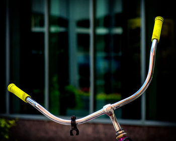 Close-up of bicycle handle against blurred background