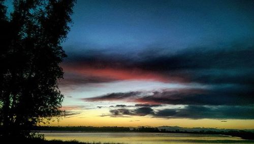 Scenic view of landscape against cloudy sky