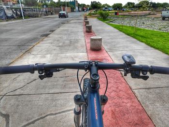 Close-up of bicycle parked on road