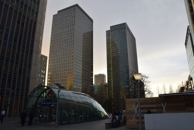 Modern buildings against sky in city