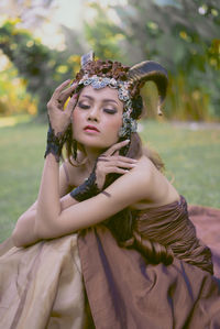 Portrait of young woman wearing traditional dress