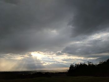 Storm clouds over field