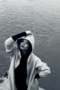 Portrait of woman standing on pier