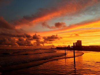 Scenic view of calm sea at sunset