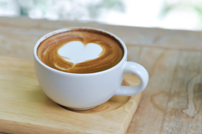 Close-up of cappuccino on table