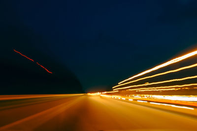 Light trails on road at night