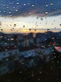 Full frame shot of wet airplane window