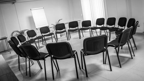 Empty chairs arranged in classroom