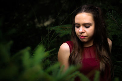 Thoughtful young woman looking away