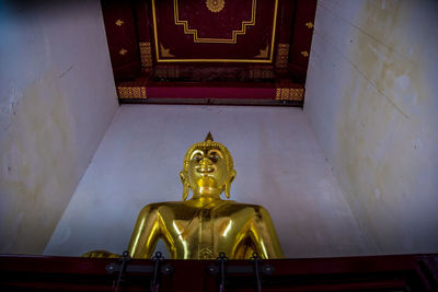 Low angle view of statue against building