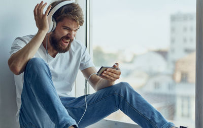 Young man using mobile phone