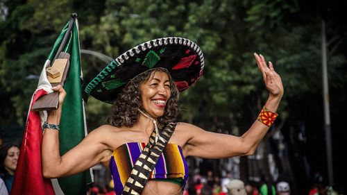 Young woman dancing in traditional clothing