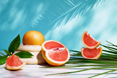 Fresh healthy grapefruit on sunlight with hard shadows. minimal food creative concept