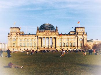 Group of people in front of historical building