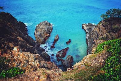 High angle view of rocks in sea