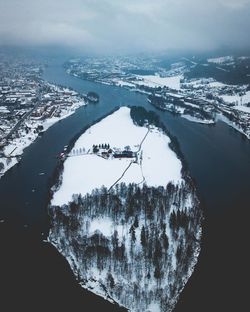 Scenic view of frozen sea against sky during winter