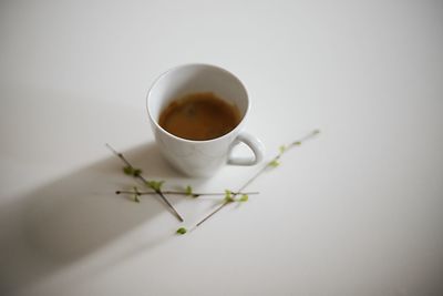 High angle view of coffee cup on table